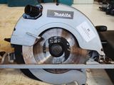 a circular saw sitting on a table in a workshop