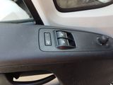 a close up of a car door handle with a window open