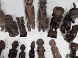 a lot of wooden figurines that are sitting on a table