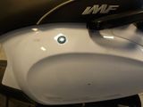 a close up of a motorcycle with a black seat
