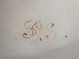 a close up of a white bowl with writing on it