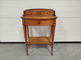 a small wooden table with a drawer underneath it