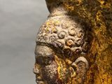 an image of a statue of a woman with a hat on her head