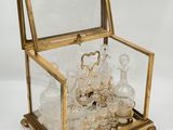 an image of a glass and brass box with a mirror inside