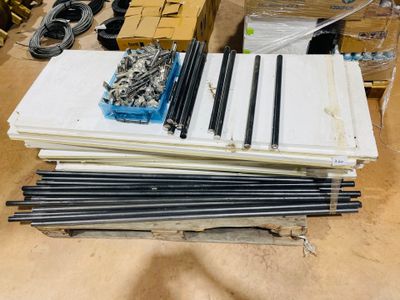 a pile of metal rods and other items on a table