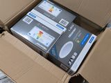 several boxes of electronic devices are stacked on top of each other
