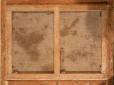 an old window with a screen on the outside of it