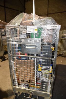 a metal cart with many items in it in a warehouse