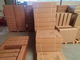 many cardboard boxes stacked on top of each other in a warehouse
