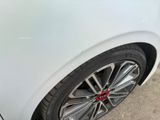 a close up of a car ' s tire on the street