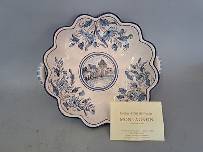 a blue and white plate with a picture of a castle on it