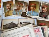 a lot of old postcards of soldiers on a table
