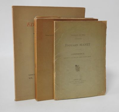 three books sitting on top of each other on a white surface