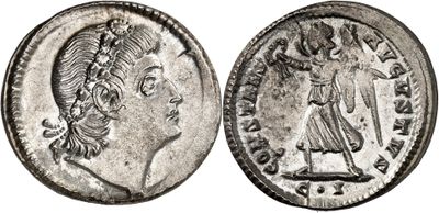 a silver coin with an image of a woman on it