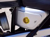 a close up of a motorcycle parked on the side of the road