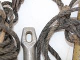 a pair of scissors sitting next to a bunch of rope