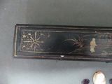a black box with a picture of a woman on it