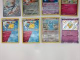 beaucoup de cartes pokemon sur le mur