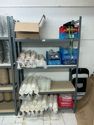 a shelf with many items on it in a room