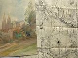 two maps on the table with a map of a town