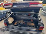 a trunk of a car that is parked on the side of the street