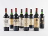 six bottles of wine are lined up on a white surface