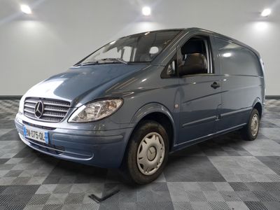 a picture of a blue van parked on a checkered floor