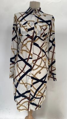an image of a mannequin dress with chains on it