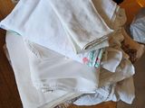 a pile of folded towels sitting on top of a wooden table