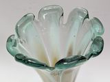 a glass vase that is sitting on a table