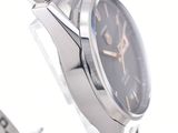 a close up of a wrist watch on a white surface