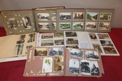 a lot of old photographs on the table