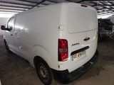 a white van that is parked in a garage