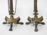 pair of antique brass candlesticks with chains on stands