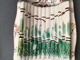 a plate with a green and white design on it