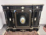 a black cabinet with a picture on the front