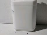 a white plastic container with a handle on the floor