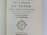 a book that is open on a white table