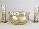 three pieces of glass sitting on a white surface