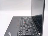 a laptop computer sitting on a table with a keyboard