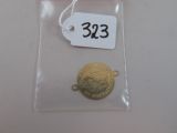 une pièce d'or dans un sachet transparent avec une étiquette de prix
