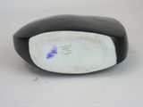 a close up of a computer mouse on a white surface