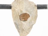 a cross with a stone on it and a stone in the middle