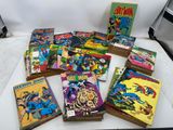 a lot of comic books sitting on a table