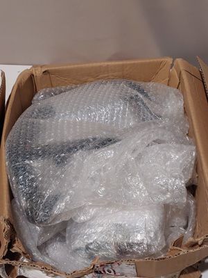 two boxes of plastic wrap sitting on a table
