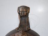 a statue of a man with a beard on a vase