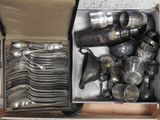 a box full of silverware sitting on a table