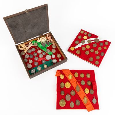 a box with coins and a red cloth on the table