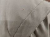 a close up of a pillow on a bed