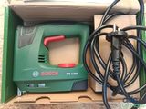 the box is open with a cord and a power tool in it
